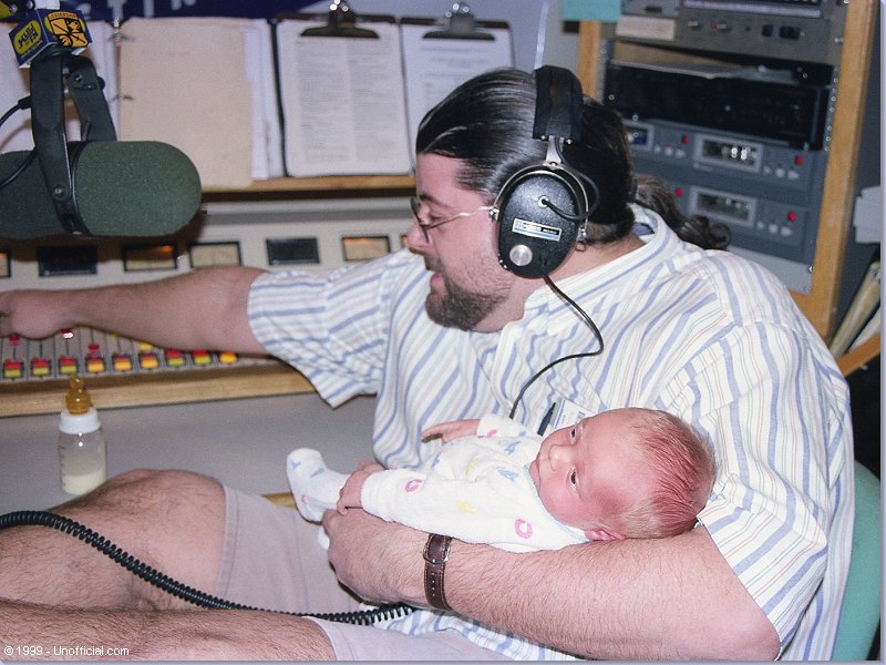 Jeff Gish with Garth and Debra's newborn son, Ethan at KLBJ-FM, Austin, Texas
